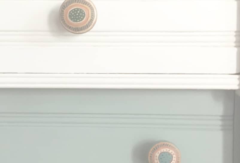 A close-up of a dresser painted with Annie Sloan Chalk Paint, and two unique drawer pulls